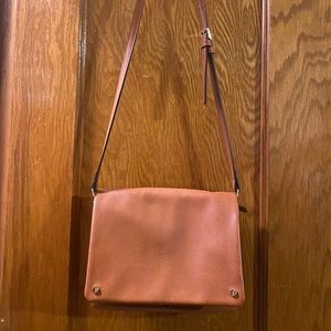Demi fold over vegan leather crossbody bag.